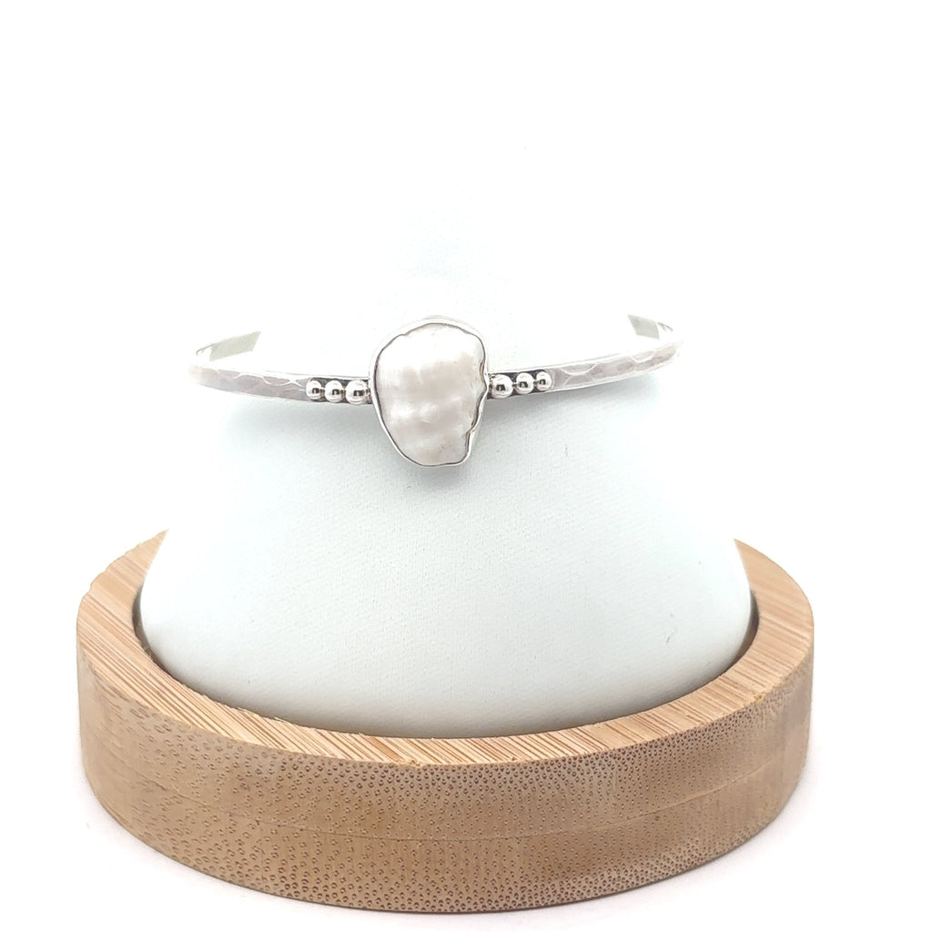 Albino Helmet Shell on the Dotted Cuff - Ocean Soul