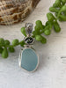 Light Blue Sea Glass Pendant with Hand-carved bail and logo - Ocean Soul