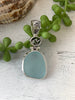 Light Blue Sea Glass Pendant with Hand-carved bail and logo - Ocean Soul