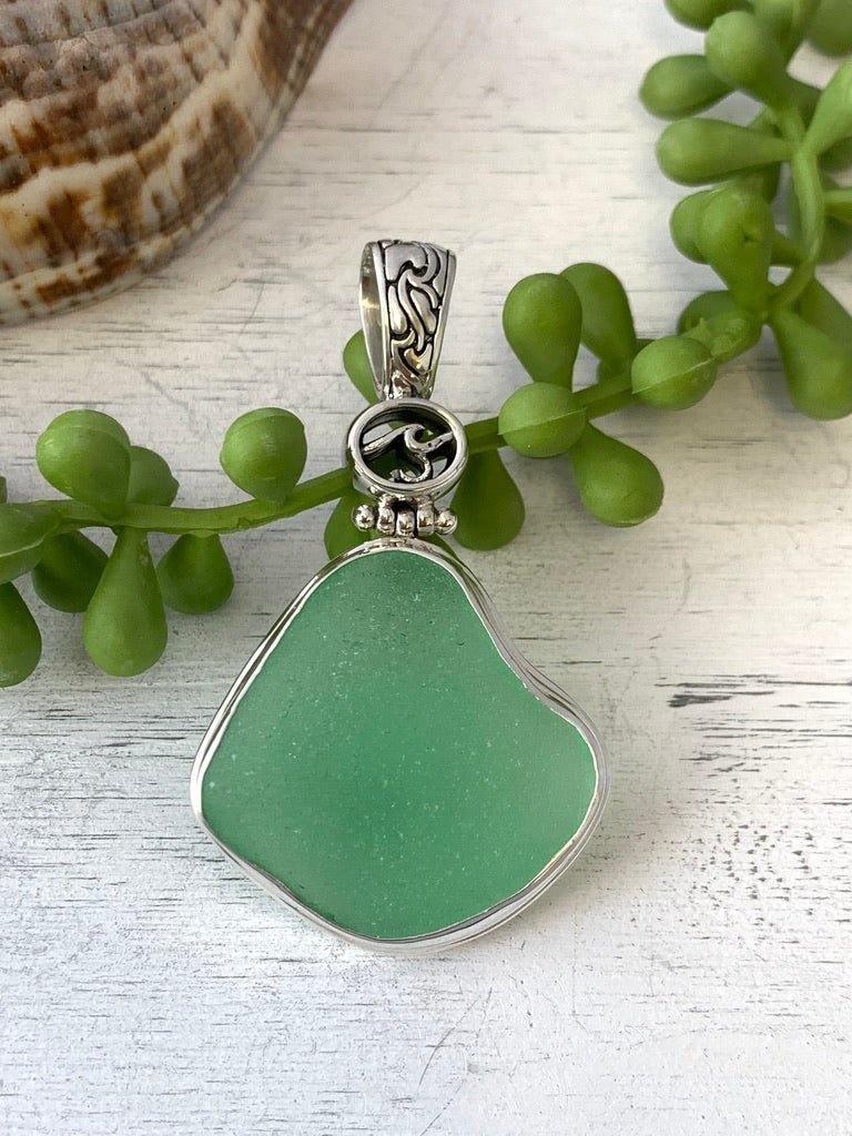 Light Green Sea Glass Pendant with Hand-carved bail and logo - Ocean Soul