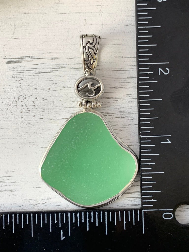 Light Green Sea Glass Pendant with Hand-carved bail and logo - Ocean Soul